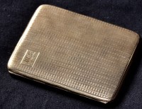 Lot 655 - A George V 9ct. gold engine turned cigarette...