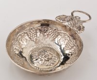Lot 669 - A Continental white metal wine taster, with...