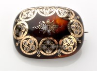 Lot 702 - A yellow and white metal inlaid tortoiseshell...