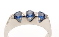 Lot 716 - A sapphire and diamond ring, three circular...