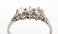 Lot 736 - A three stone diamond ring, the three...