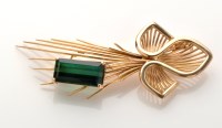 Lot 759 - A green tourmaline set yellow metal brooch,...