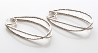 Lot 766 - A pair diamond set drop earrings, the double...