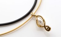Lot 771 - A baroque pearl and diamond drop pendant, in...