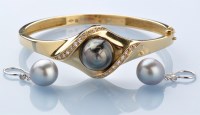 Lot 787 - A cultured black pearl and diamond set 18ct....