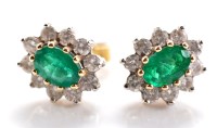 Lot 820 - A pair of emerald and diamond cluster earrings,...