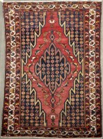Lot 1112 - A Kurdish Maslaghan rug, with jaggered diamond-...