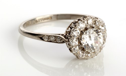 Lot 846 - A diamond cluster ring, the central diamond...