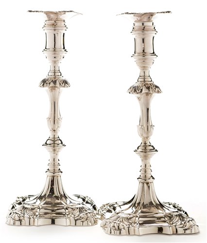 Lot 423 - A pair of George III candlesticks.
