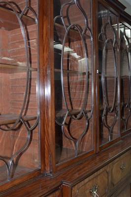 Lot 794 - A George III mahogany breakfront secretaire bookcase.