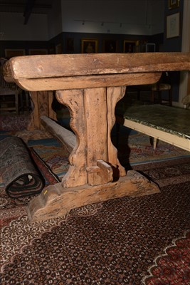 Lot 1165 - A substantial rustic oak dining table.
