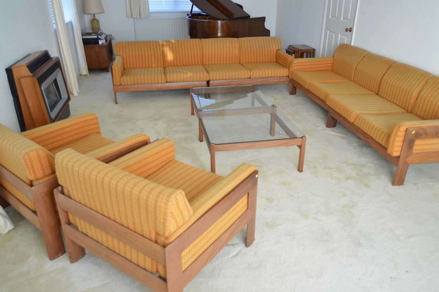 Lot 127 - A 1960's teak and Harris Tweed modular lounge suite.