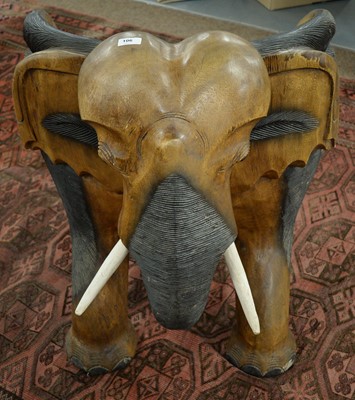 Lot 106 - An African carved elephant chair.