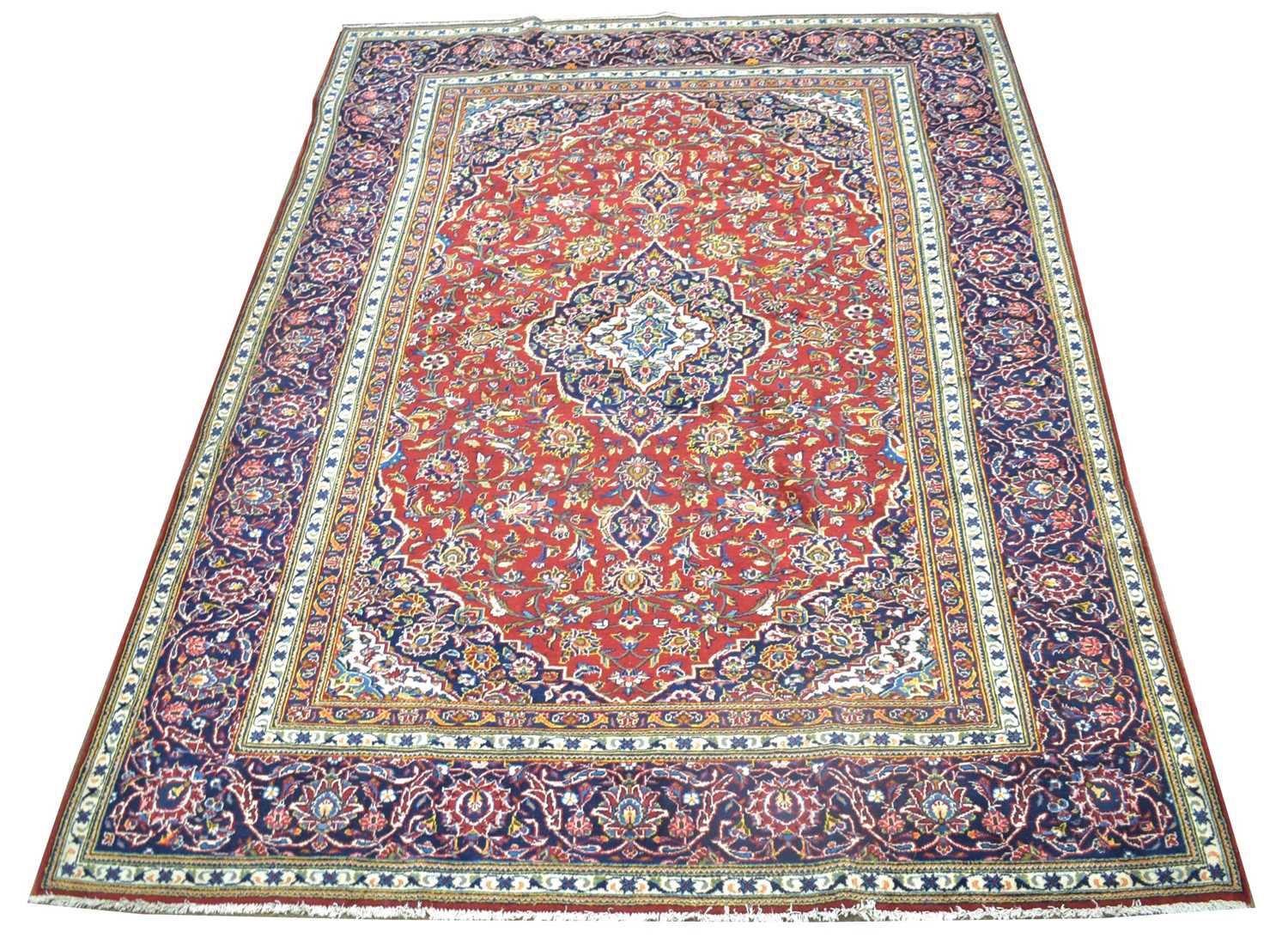 Lot 635 - A Kashan carpet.