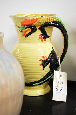 Lot 312 - Moorcroft dish, two Art Deco Burleigh Ware water jugs and  Ruskin pottery vase.