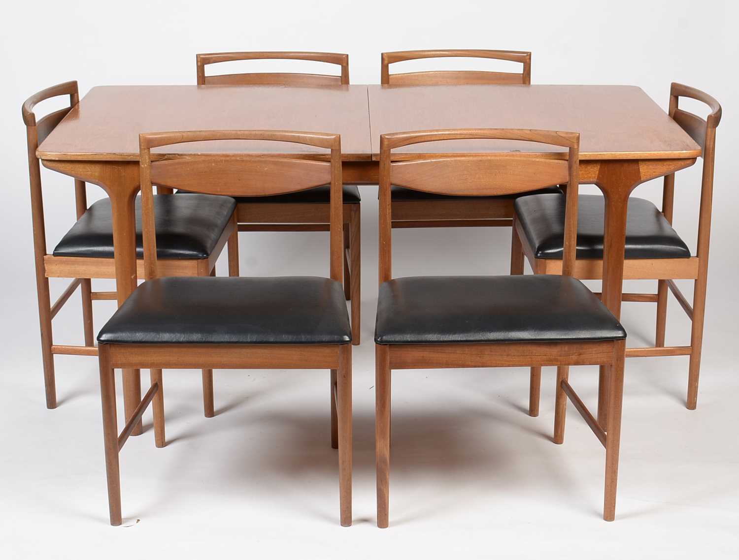 Lot 385 - A. H. McIntosh & Co. Ltd, Kirkcaldy: a mid Century teak extending dining table and six chairs.