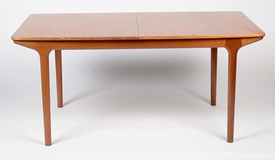 Lot 385 - A. H. McIntosh & Co. Ltd, Kirkcaldy: a mid Century teak extending dining table and six chairs.