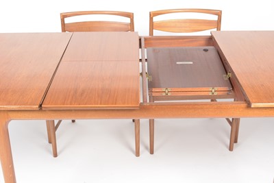 Lot 385 - A. H. McIntosh & Co. Ltd, Kirkcaldy: a mid Century teak extending dining table and six chairs.