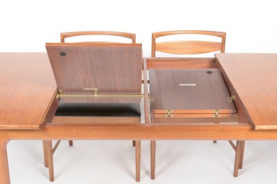 Lot 385 - A. H. McIntosh & Co. Ltd, Kirkcaldy: a mid Century teak extending dining table and six chairs.
