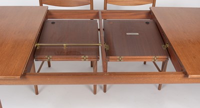 Lot 385 - A. H. McIntosh & Co. Ltd, Kirkcaldy: a mid Century teak extending dining table and six chairs.