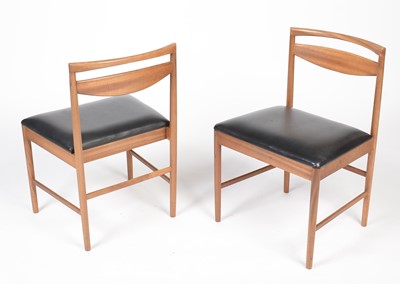 Lot 385 - A. H. McIntosh & Co. Ltd, Kirkcaldy: a mid Century teak extending dining table and six chairs.