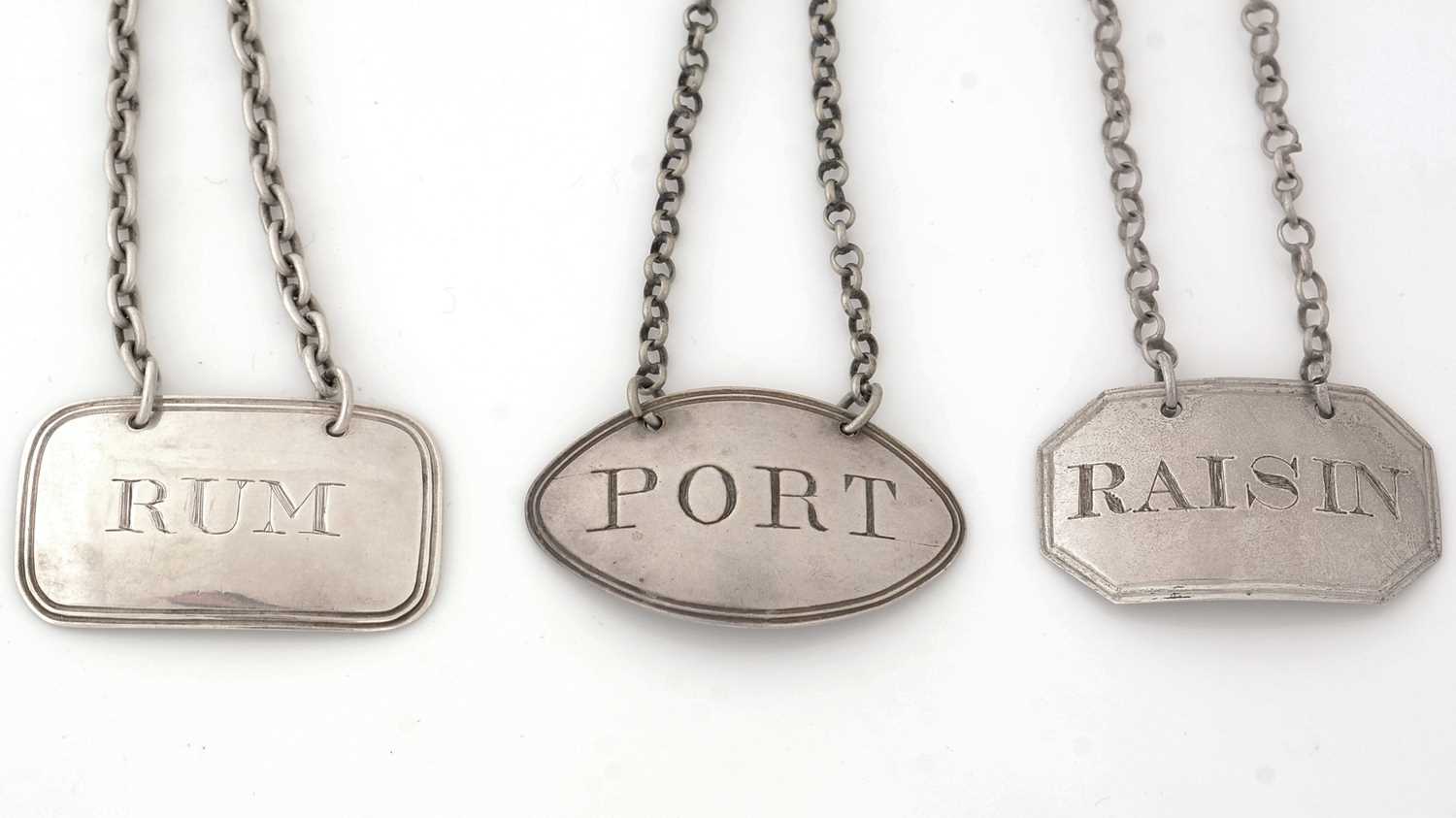 Lot 269 - Three silver wine labels, various styles and makers.