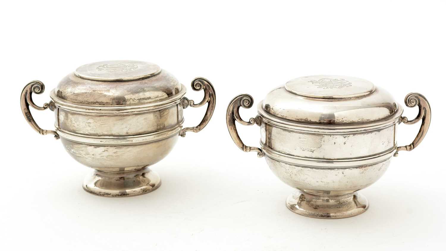 Lot 70 - A matched pair of Edwardian George V silver two handled cups
