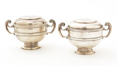 Lot 70 - A matched pair of Edwardian George V silver two handled cups