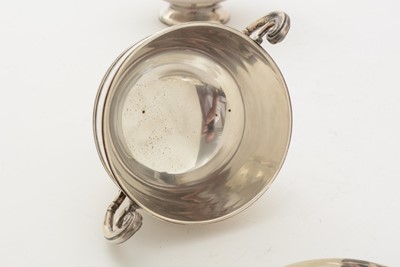 Lot 70 - A matched pair of Edwardian George V silver two handled cups