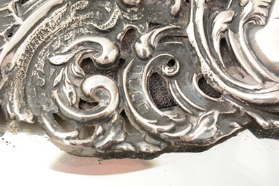 Lot 90 - An Edwardian silver mounted dressing table mirror