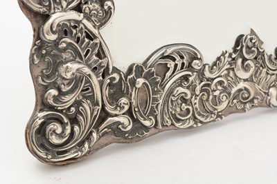 Lot 90 - An Edwardian silver mounted dressing table mirror