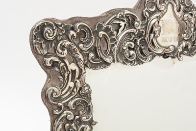 Lot 90 - An Edwardian silver mounted dressing table mirror