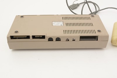 Lot 271 - A Commodore 64 home computer, with a cassette player and a selection of cassette games.
