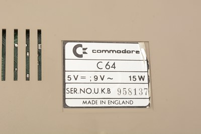 Lot 271 - A Commodore 64 home computer, with a cassette player and a selection of cassette games.