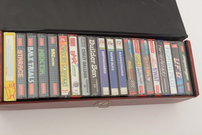 Lot 271 - A Commodore 64 home computer, with a cassette player and a selection of cassette games.