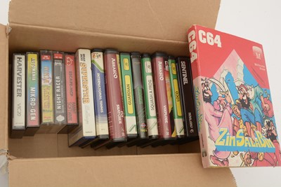 Lot 271 - A Commodore 64 home computer, with a cassette player and a selection of cassette games.