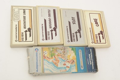 Lot 271 - A Commodore 64 home computer, with a cassette player and a selection of cassette games.