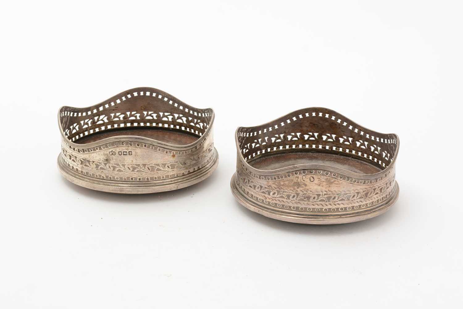 Lot 93 - George III Irish silver wine coaster; and an Edwardian silver wine coaster