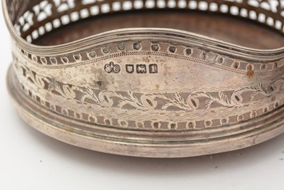Lot 93 - George III Irish silver wine coaster; and an Edwardian silver wine coaster