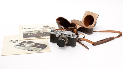 Lot 397 - A Leica IIIa rangefinder camera; and accessories