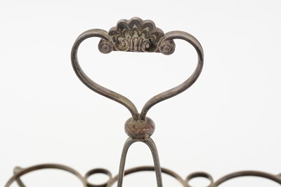 Lot 95 - A George III silver cruet frame; and other items