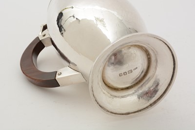 Lot 5 - An Elizabeth II silver handmade coffee pot