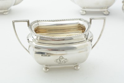 Lot 52 - An Edwardian three piece silver tea set and matching coffee pot