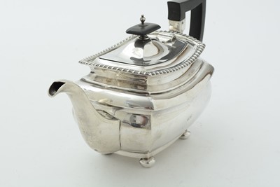 Lot 52 - An Edwardian three piece silver tea set and matching coffee pot