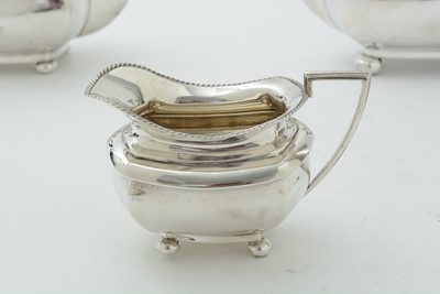 Lot 52 - An Edwardian three piece silver tea set and matching coffee pot