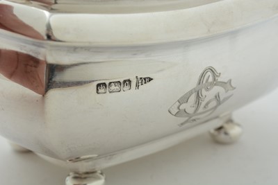 Lot 52 - An Edwardian three piece silver tea set and matching coffee pot