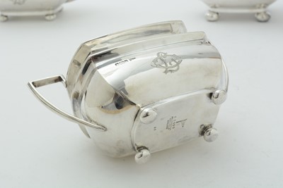 Lot 52 - An Edwardian three piece silver tea set and matching coffee pot