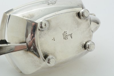 Lot 52 - An Edwardian three piece silver tea set and matching coffee pot