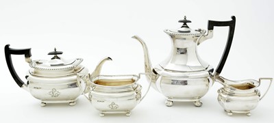 Lot 52 - An Edwardian three piece silver tea set and matching coffee pot
