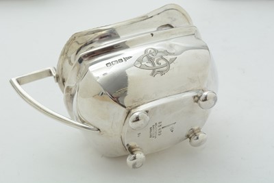 Lot 52 - An Edwardian three piece silver tea set and matching coffee pot